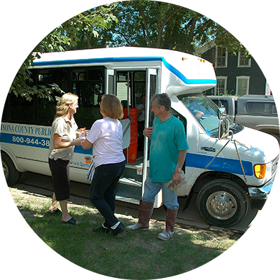 Image of people getting onto a bus in Greater Minnesota