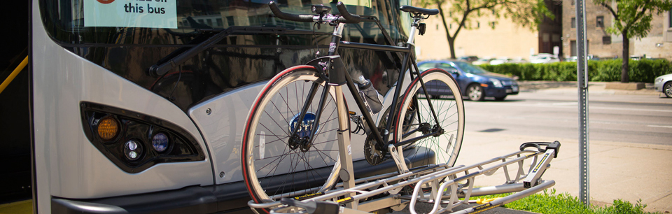 Image of a city bus with a bike