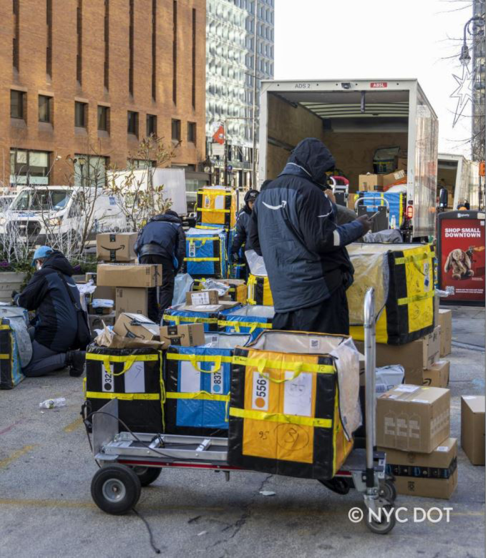 A large number of packages being unloaded from a delivery vehicle.